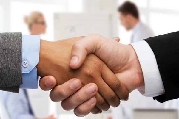 ISO 44001 Collaborative business partners shaking hands